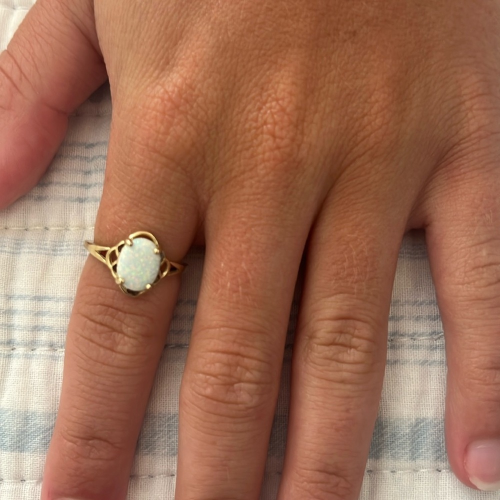 This is a 10K solid gold oval opal ring in a size 6!